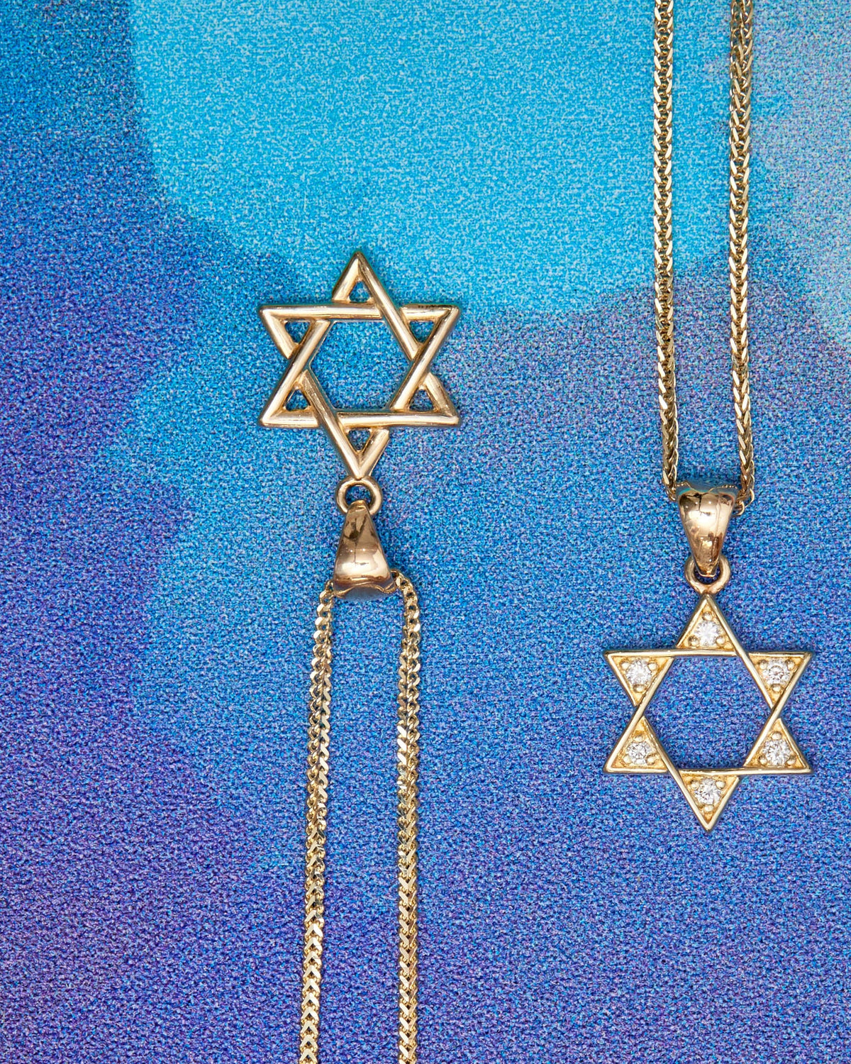 Diamond Star of David Talisman Charm on a blue and purple background.