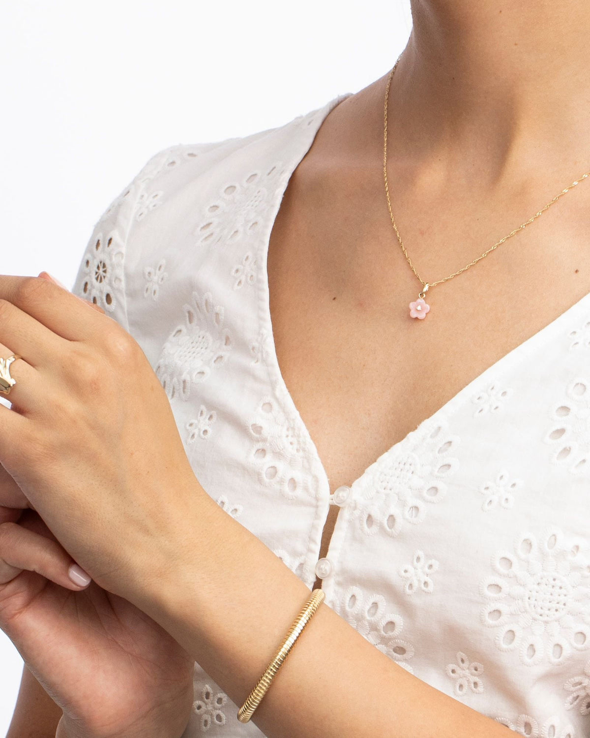 Diamond Blossom Peruvian Opal Charm worn with a white eyelet blouse.